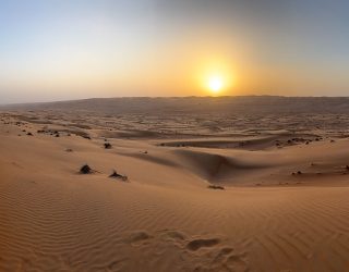 Zon tijdens quadrit in woestijn Oman